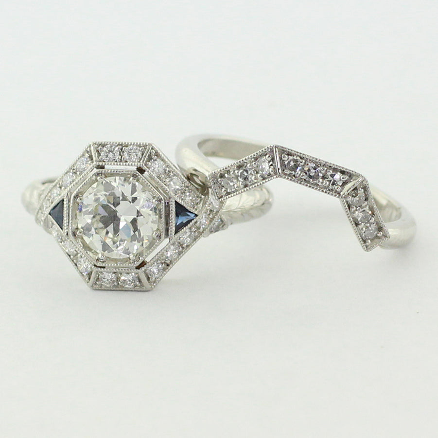 Custom platinum shadow band featuring nine 1.5mm single cut diamonds with matching milgrain.