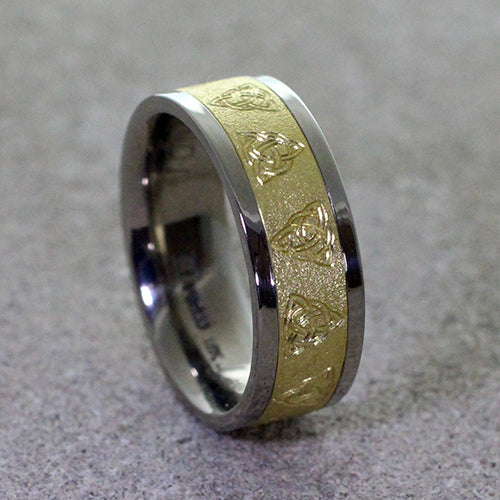 Crafted from a harmonious blend of palladium & 14ky gold. Adorning the band are intricately engraved triquetra celtic knots, symbolizing the interconnectedness of past, present, and future.