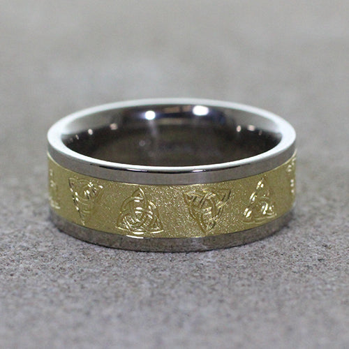 Crafted from a harmonious blend of palladium & 14ky gold. Adorning the band are intricately engraved triquetra celtic knots, symbolizing the interconnectedness of past, present, and future.
