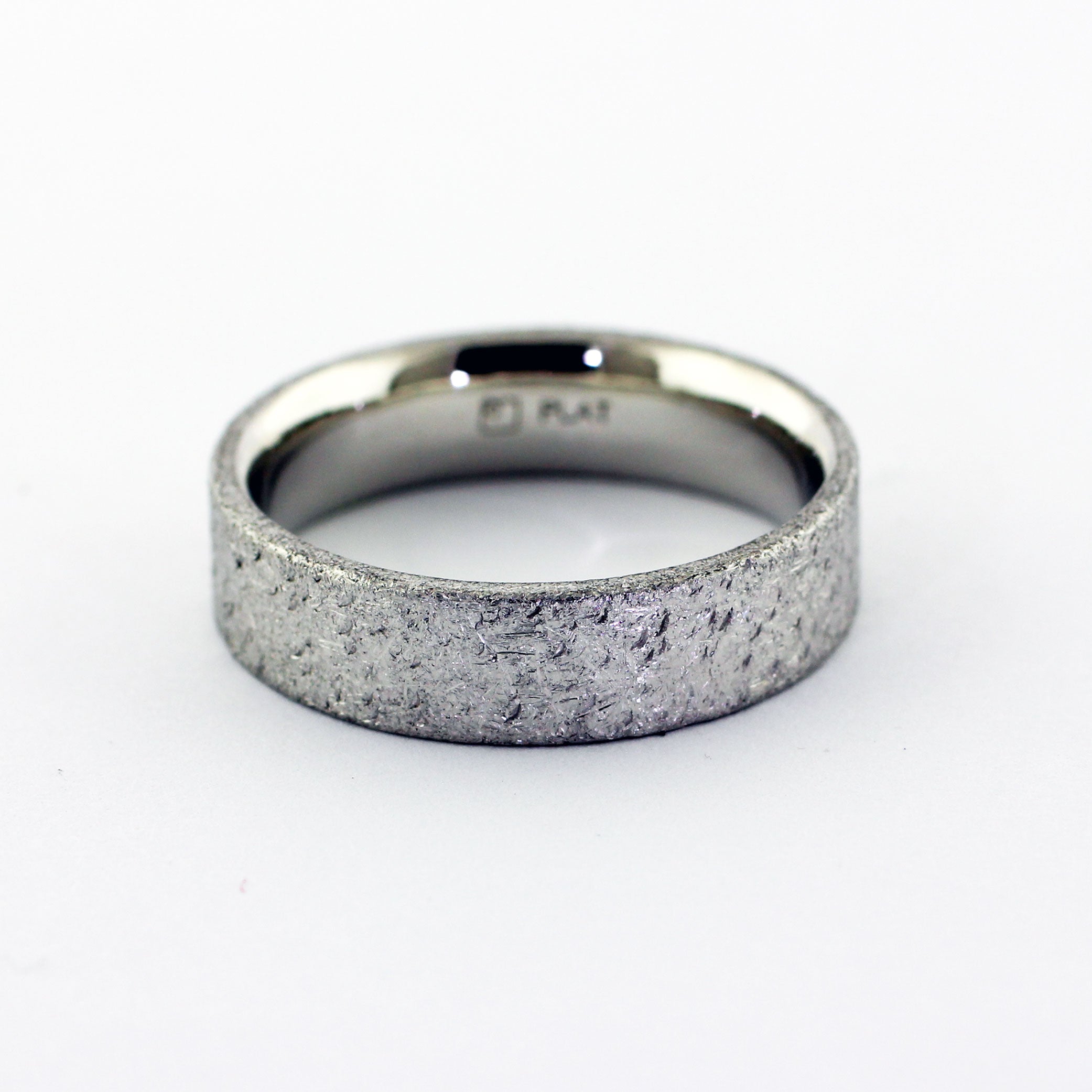Rough, rustic, and distressed. A new scratch or scuff will only add to it's beauty. A timeless wedding band that can be dressed up or stripped down to meet the needs of the wearer. -Made to order and hand fabricated from palladium-