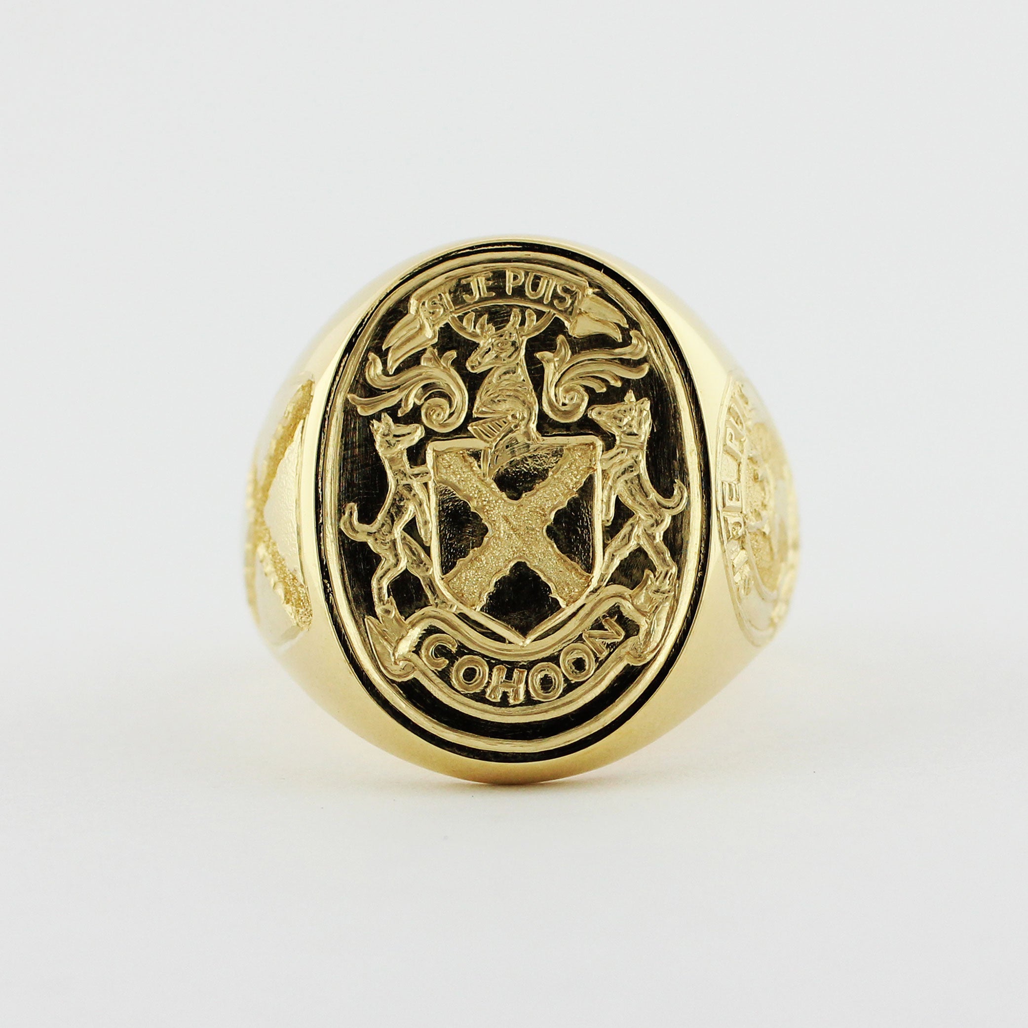Custom 18ky signet ring with engraved family crest.