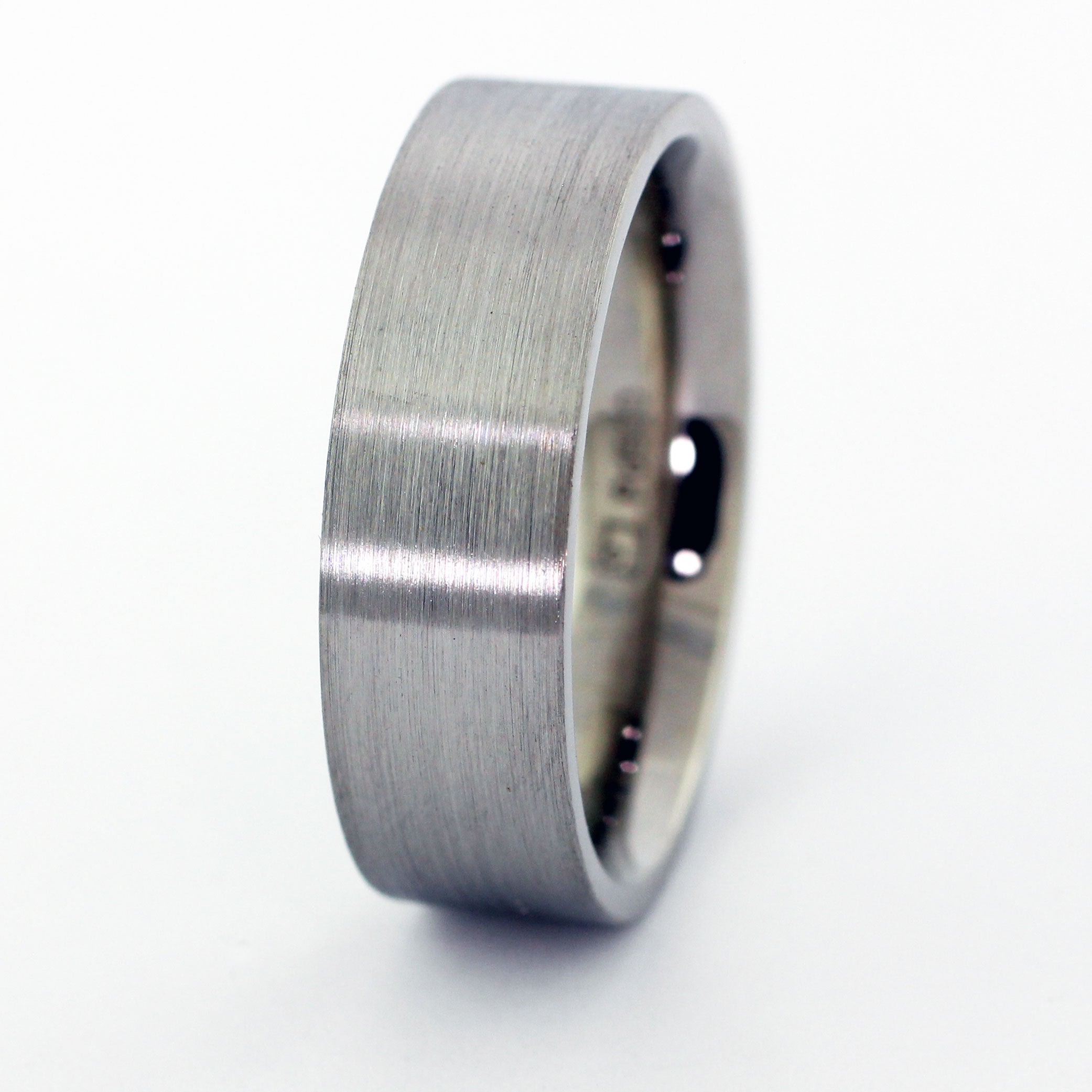 Custom palladium men's wedding band with a modern square top and brushed finish.