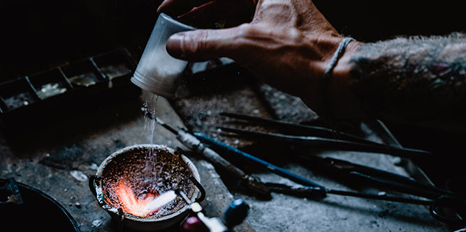 Our jeweler carefully prepares a customer&#39;s heirloom metal for casting, ensuring meticulous attention to detail.