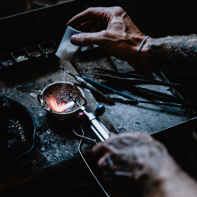 Our jeweler carefully prepares a customer's heirloom metal for casting, ensuring meticulous attention to detail.