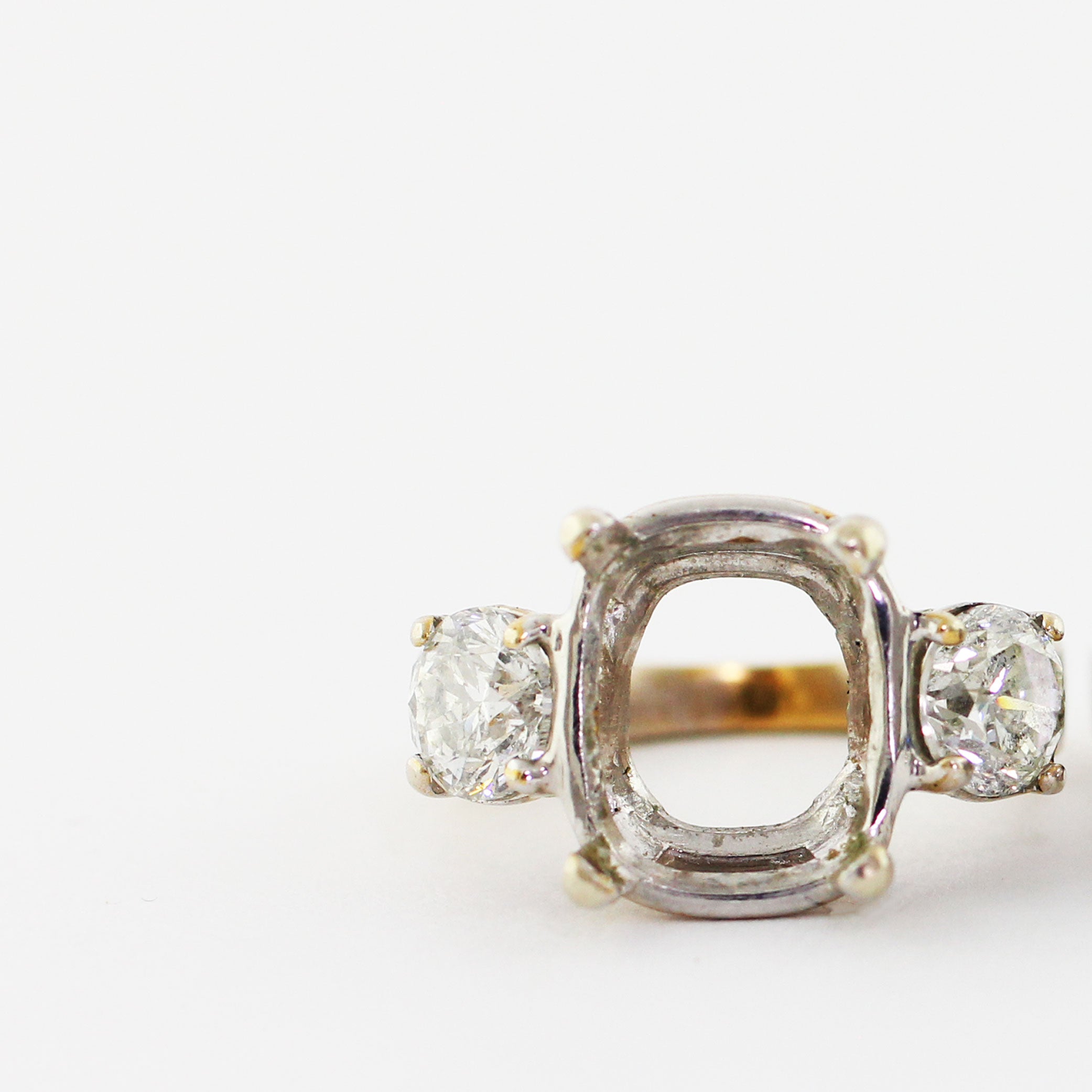 14k white gold three stone ring in need of a replacement center stone.