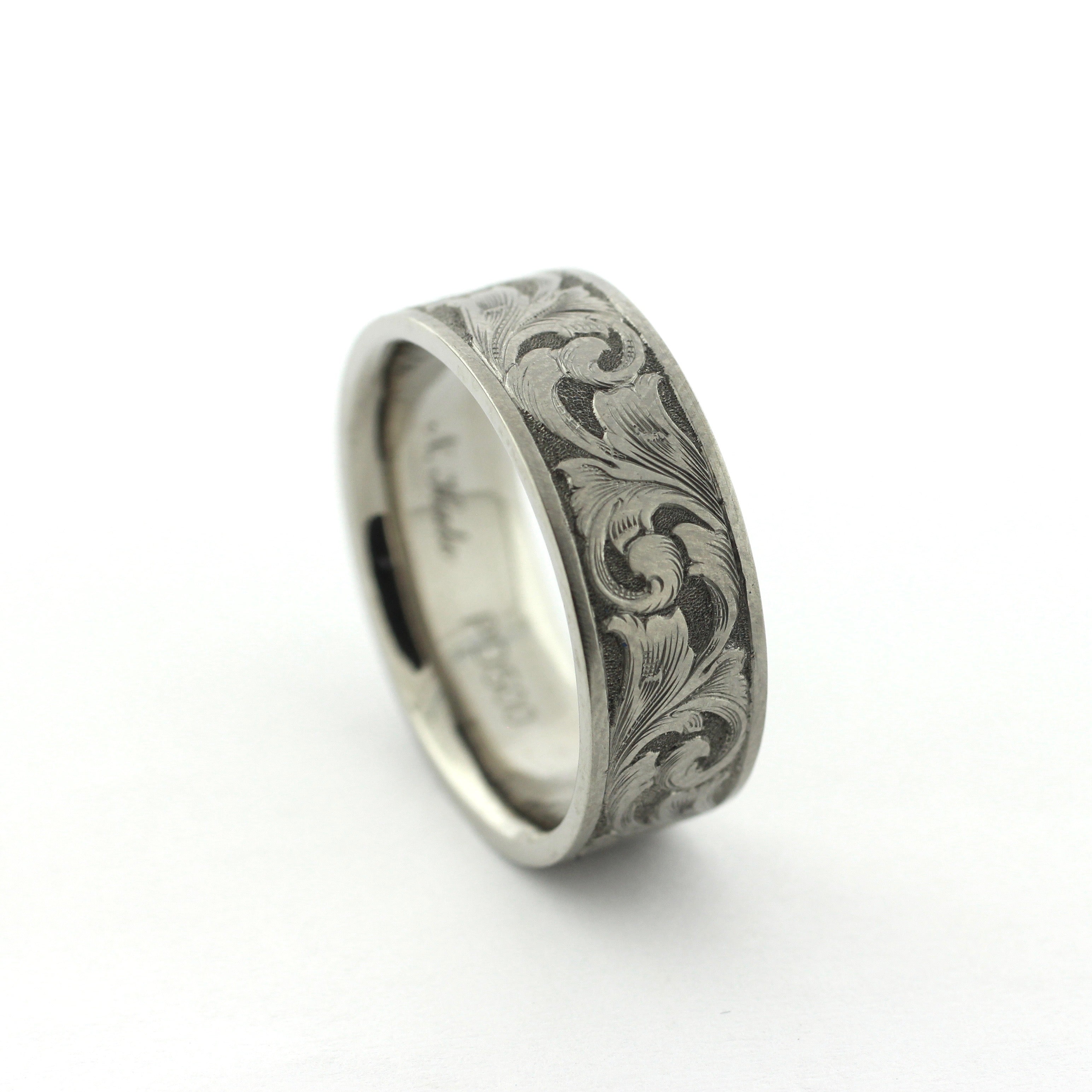 The Remington hand-engraved PD500 palladium band with flowing scrollwork inspired by classic American engraving.