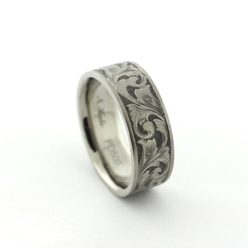 The Remington hand-engraved PD500 palladium band with flowing scrollwork inspired by classic American engraving.