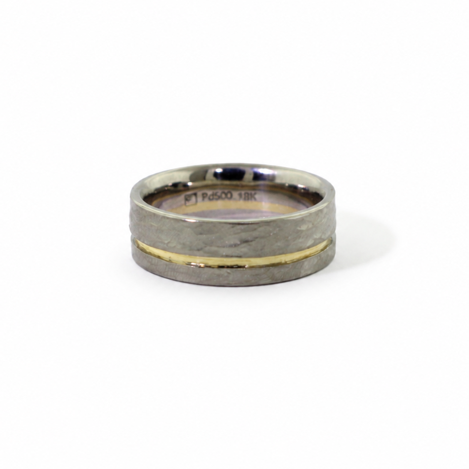 Mize Band in Palladium 500 with an off-center yellow gold stripe, hammered rustic texture, and comfort fit interior.