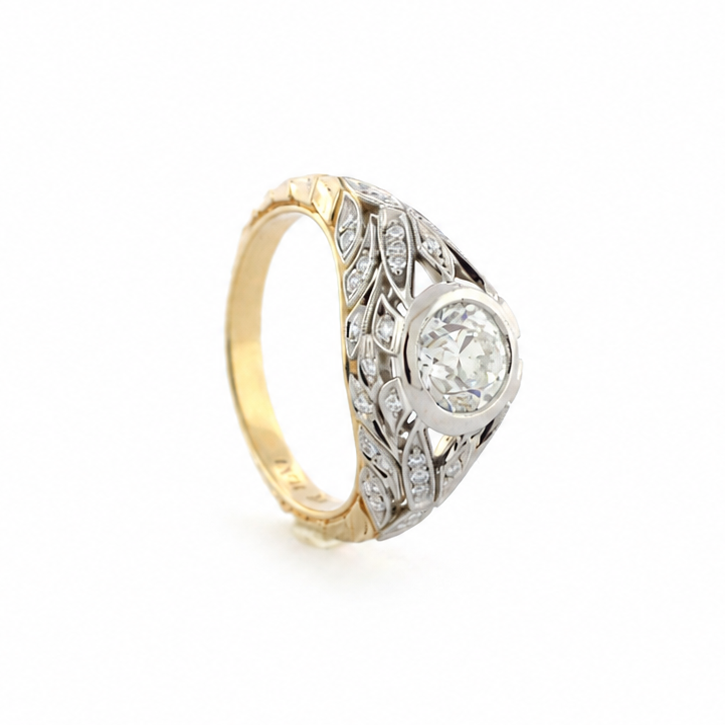 Van Zyl two-tone platinum and 14k yellow gold ring with a 1 ct old mine cut diamond, diamond accents, and hand-sculpted laurel leaf shank.