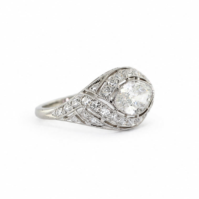 Ava Jane Art Deco platinum ring featuring a 1.13 ct east-west marquise diamond in an illusion bezel setting with accent diamonds and hand-applied milgrain detail.