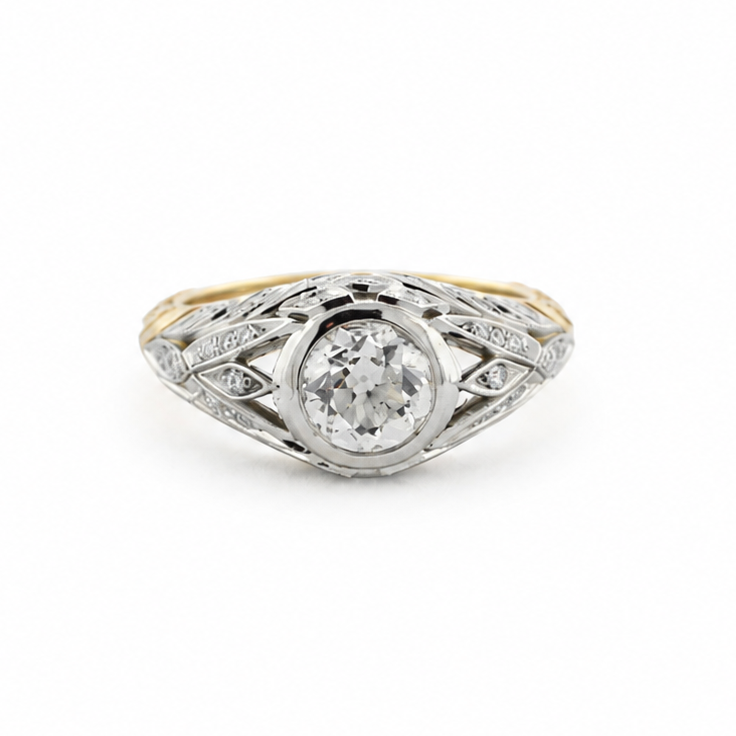 Van Zyl two-tone platinum and 14k yellow gold ring with a 1 ct old mine cut diamond, diamond accents, and hand-sculpted laurel leaf shank.