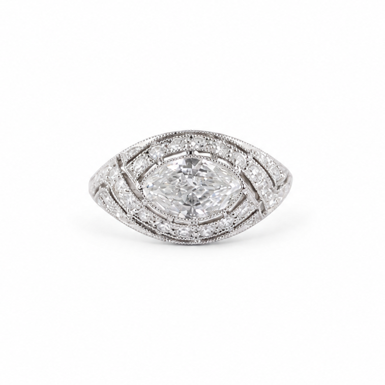 Ava Jane Art Deco platinum ring featuring a 1.13 ct east-west marquise diamond in an illusion bezel setting with accent diamonds and hand-applied milgrain detail.