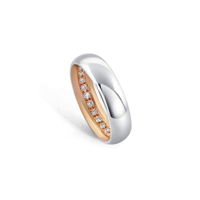 Two-tone Ott Band with Palladium 500 outer sleeve, 14k rose gold inner sleeve, and hidden full eternity diamonds inside the ring.