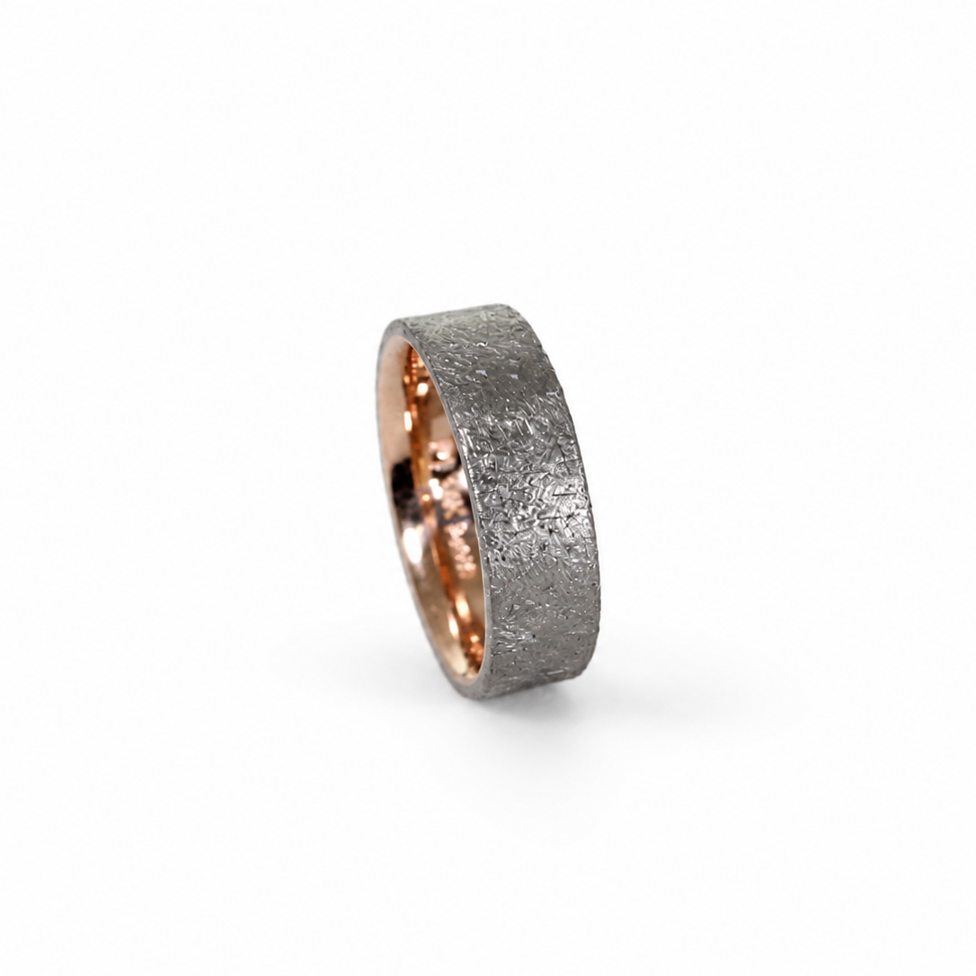Duke two-tone band with Palladium 500 rustic exterior, 14k rose or yellow gold inner sleeve, and polished comfort fit interior.