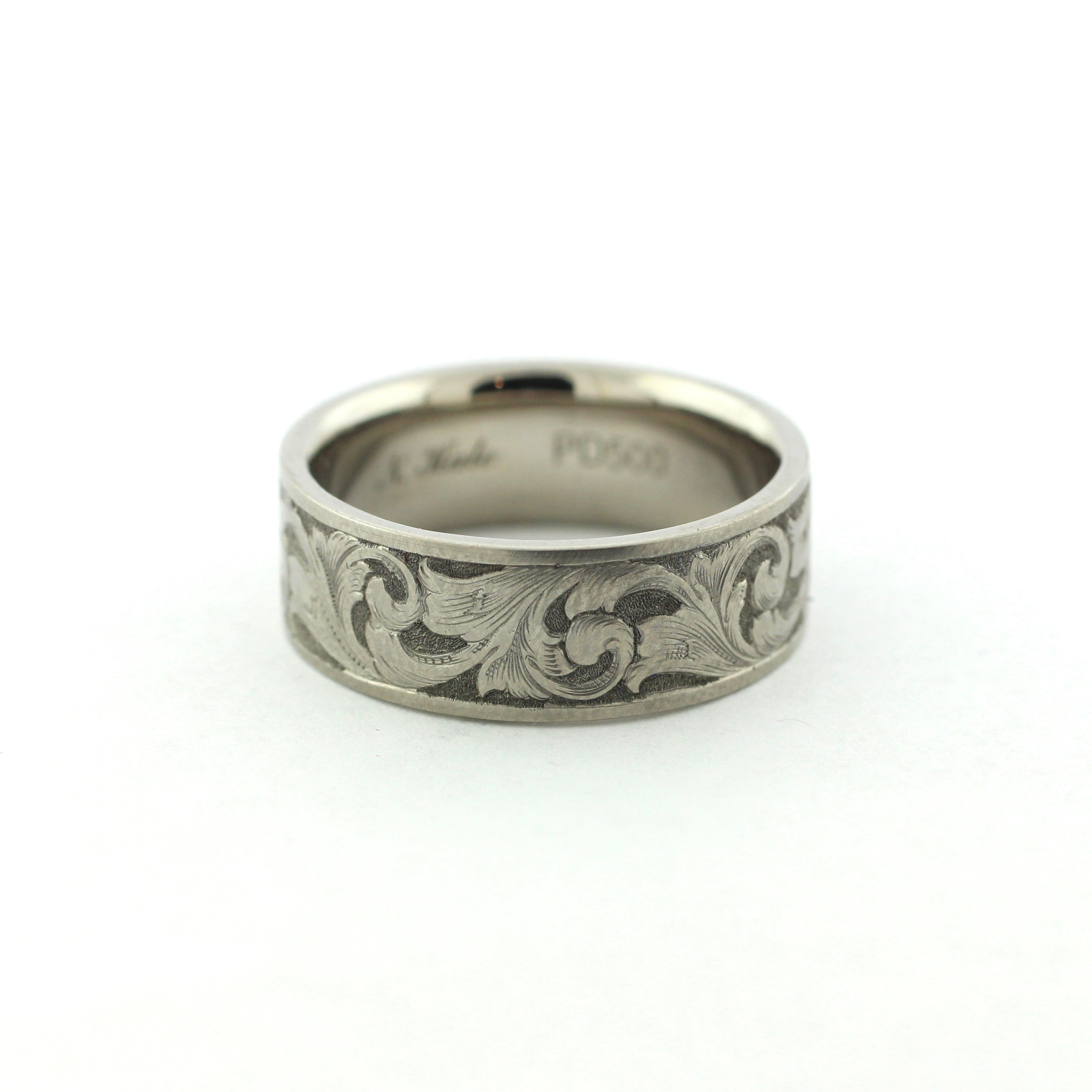 The Remington hand-engraved PD500 palladium band with flowing scrollwork inspired by classic American engraving.