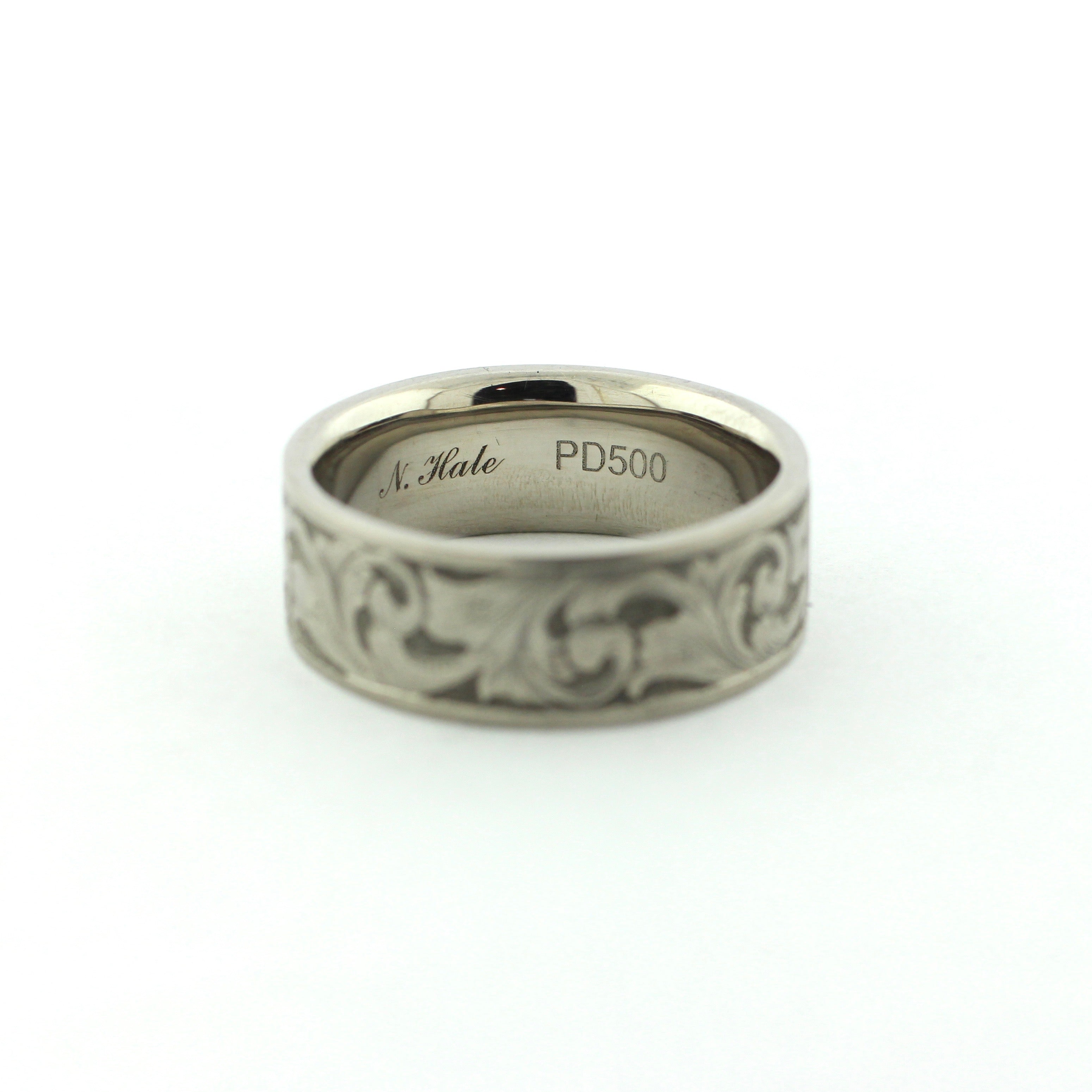 The Remington hand-engraved PD500 palladium band with flowing scrollwork inspired by classic American engraving.