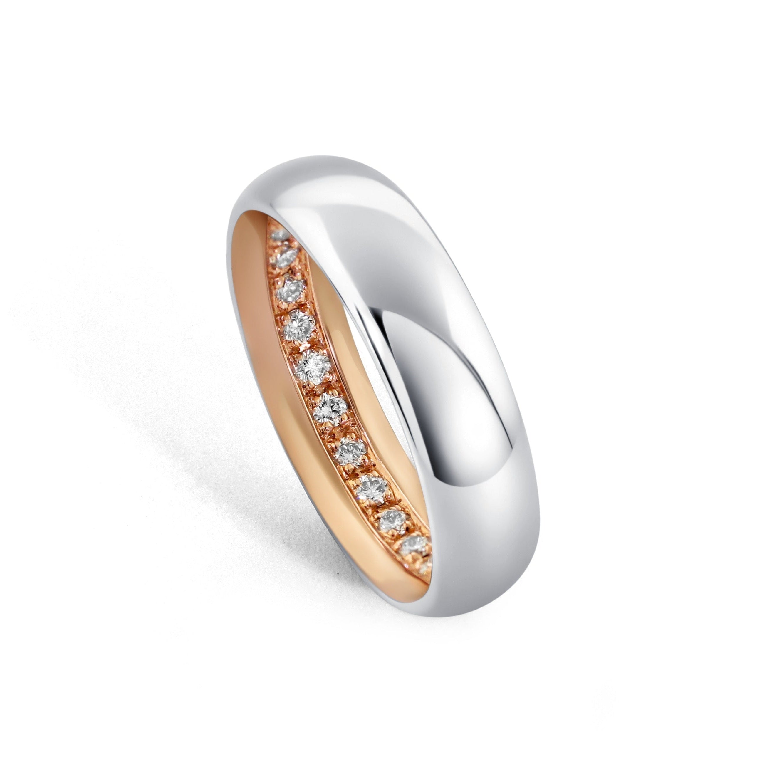 The Two-Tone Ott Band features a Palladium 500 outer sleeve, 14k rose gold inner sleeve, and a hidden full eternity row of diamonds inside the ring.